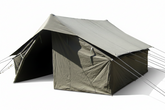 Green canvas tent on grass with trees in the background